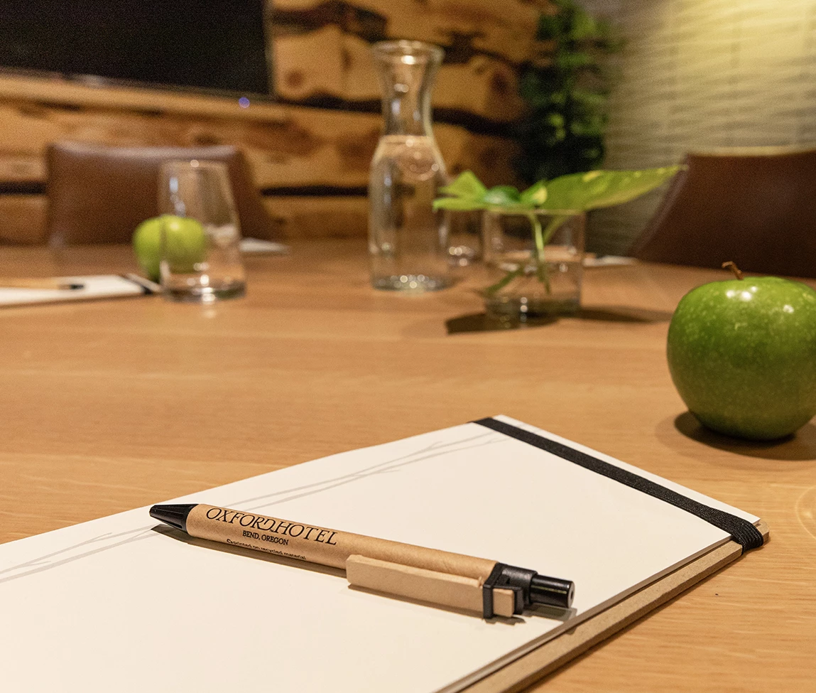 a pen on a notebook on a table