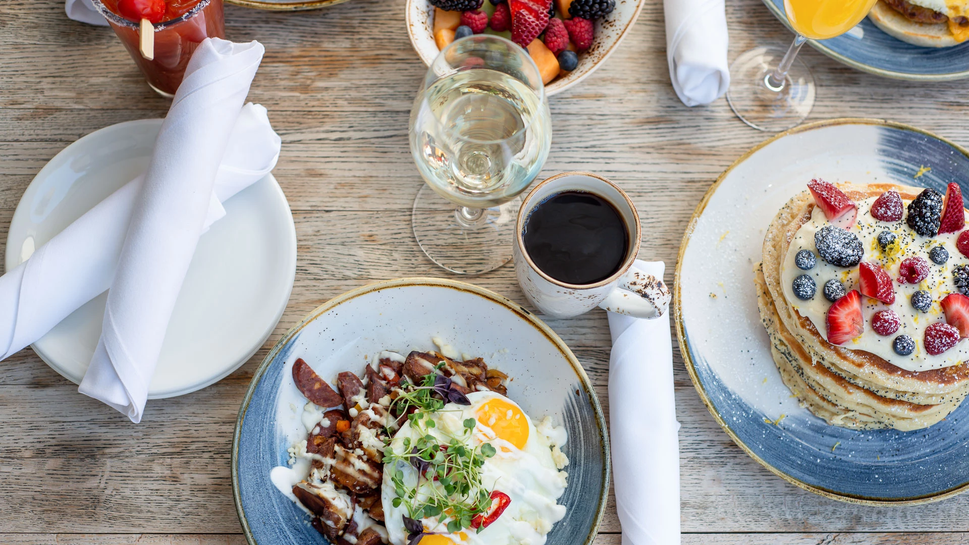 a plate of food and a drink on a table
