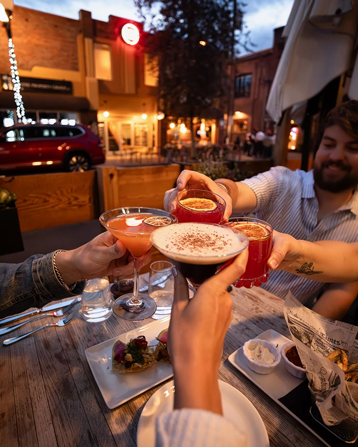a group of people holding drinks