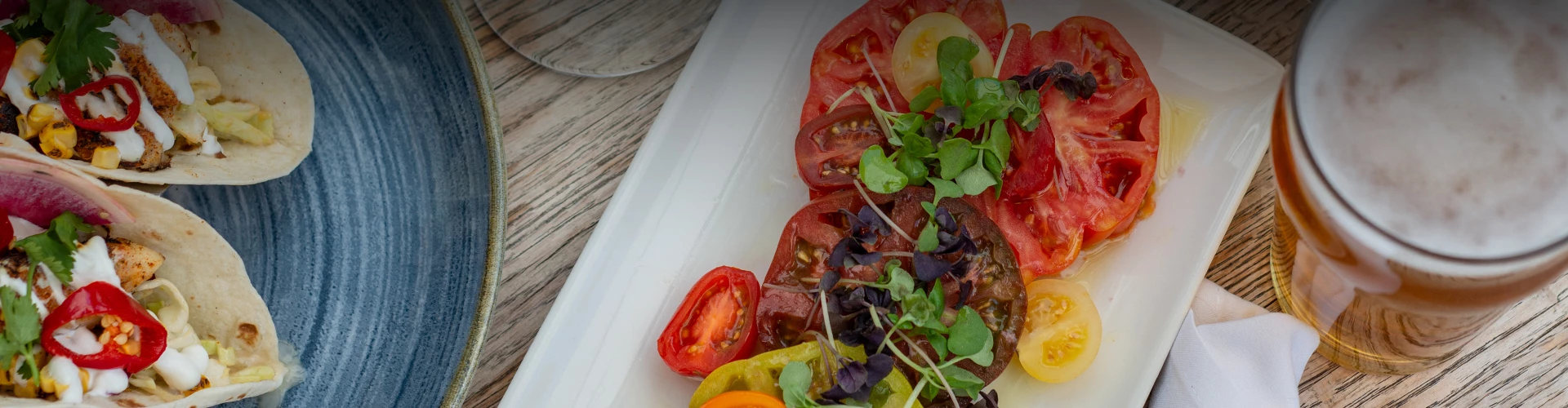 a plate of tomatoes and greens