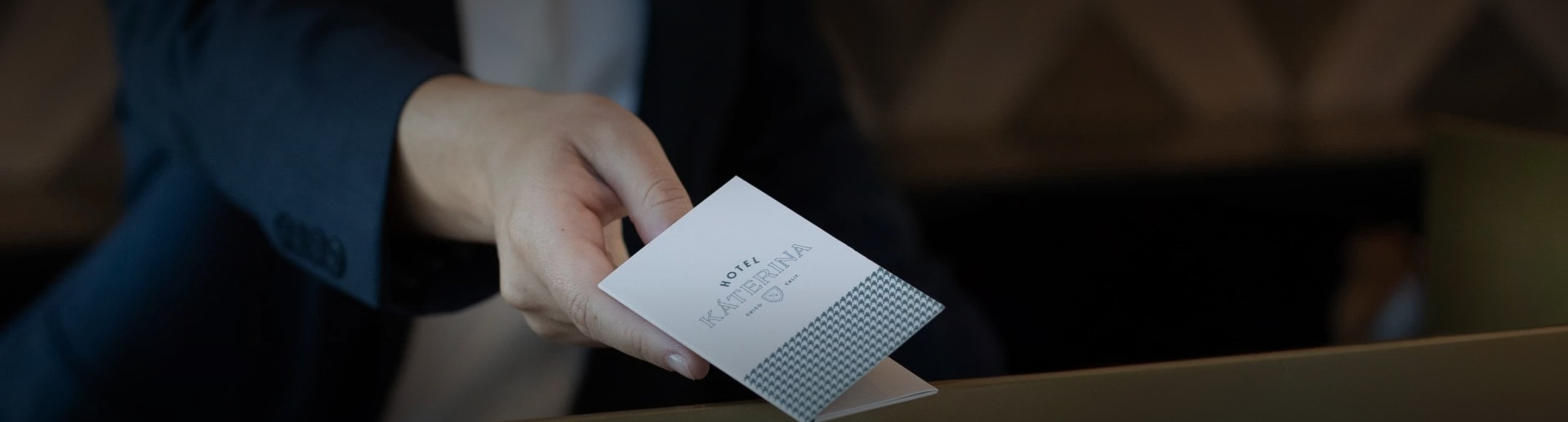 a hand holding a card