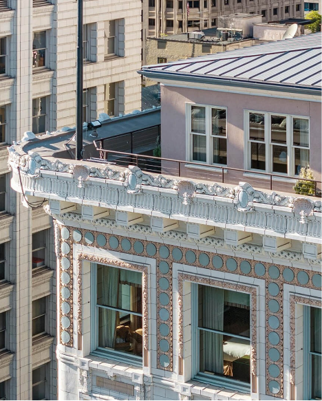 a building with a balcony and a lamp post