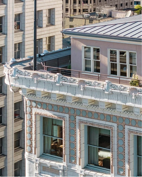 a building with a balcony and a lamp post
