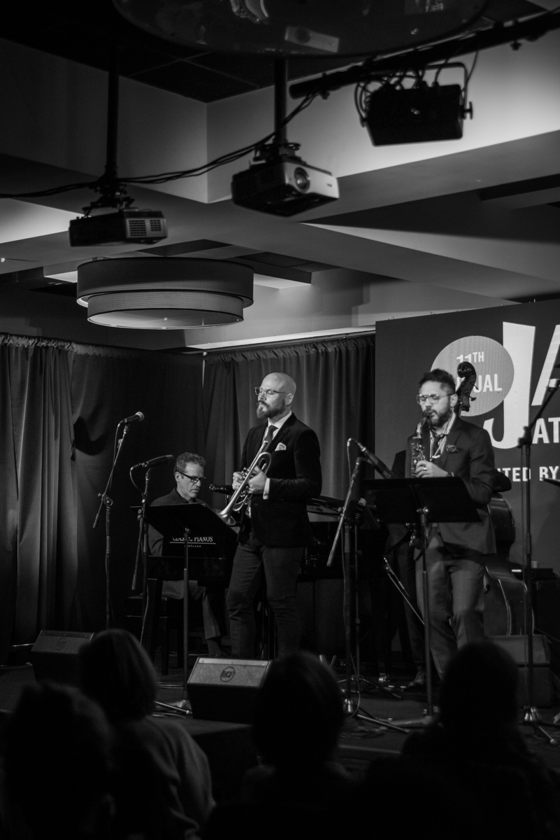 a group of men playing instruments on a stage