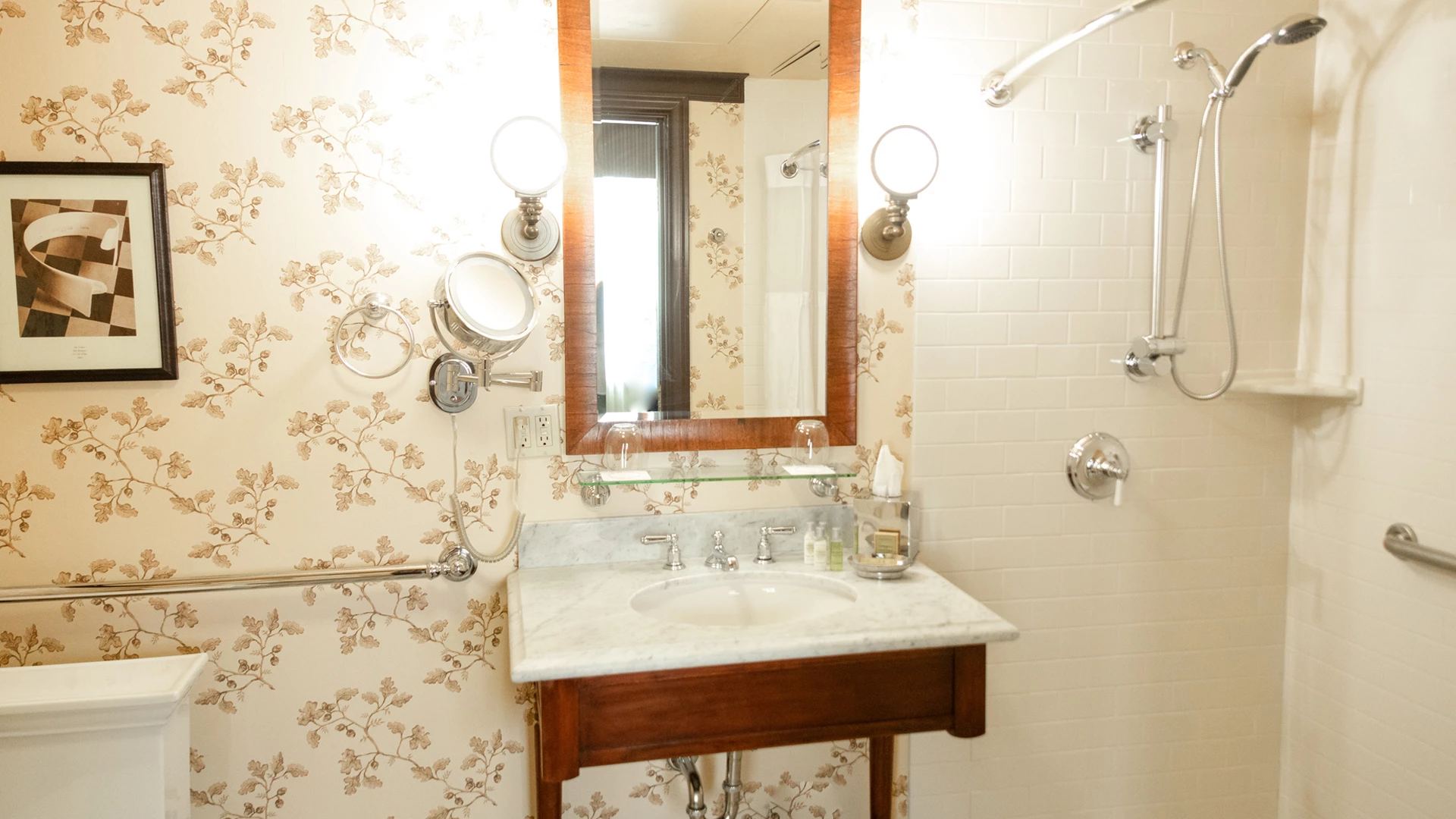 A bathroom with a sink, mirror, shower, and tub