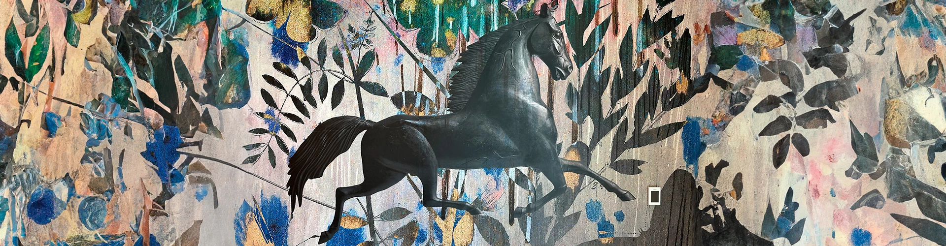 a black horse with a floral pattern on the wall