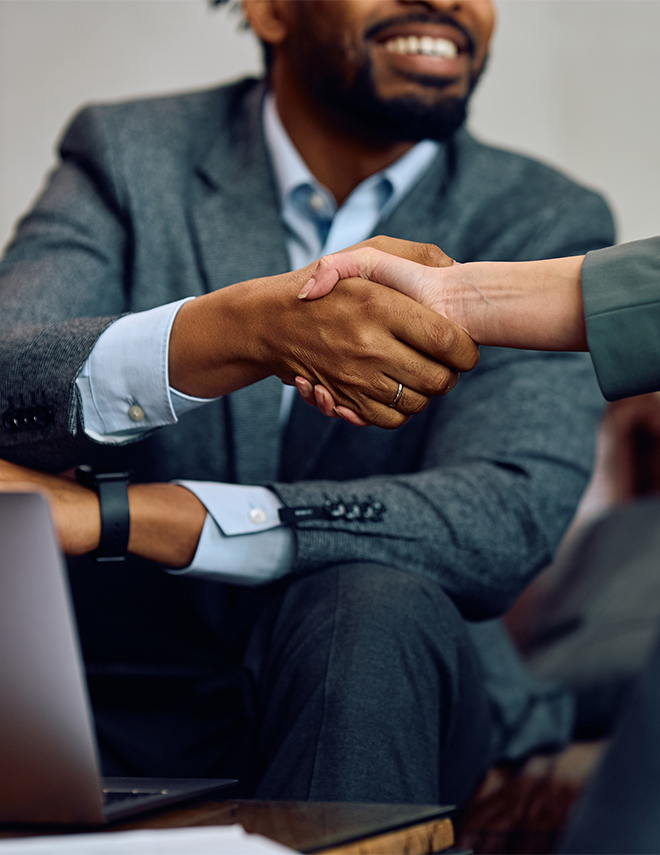 a close-up of a man shaking hands