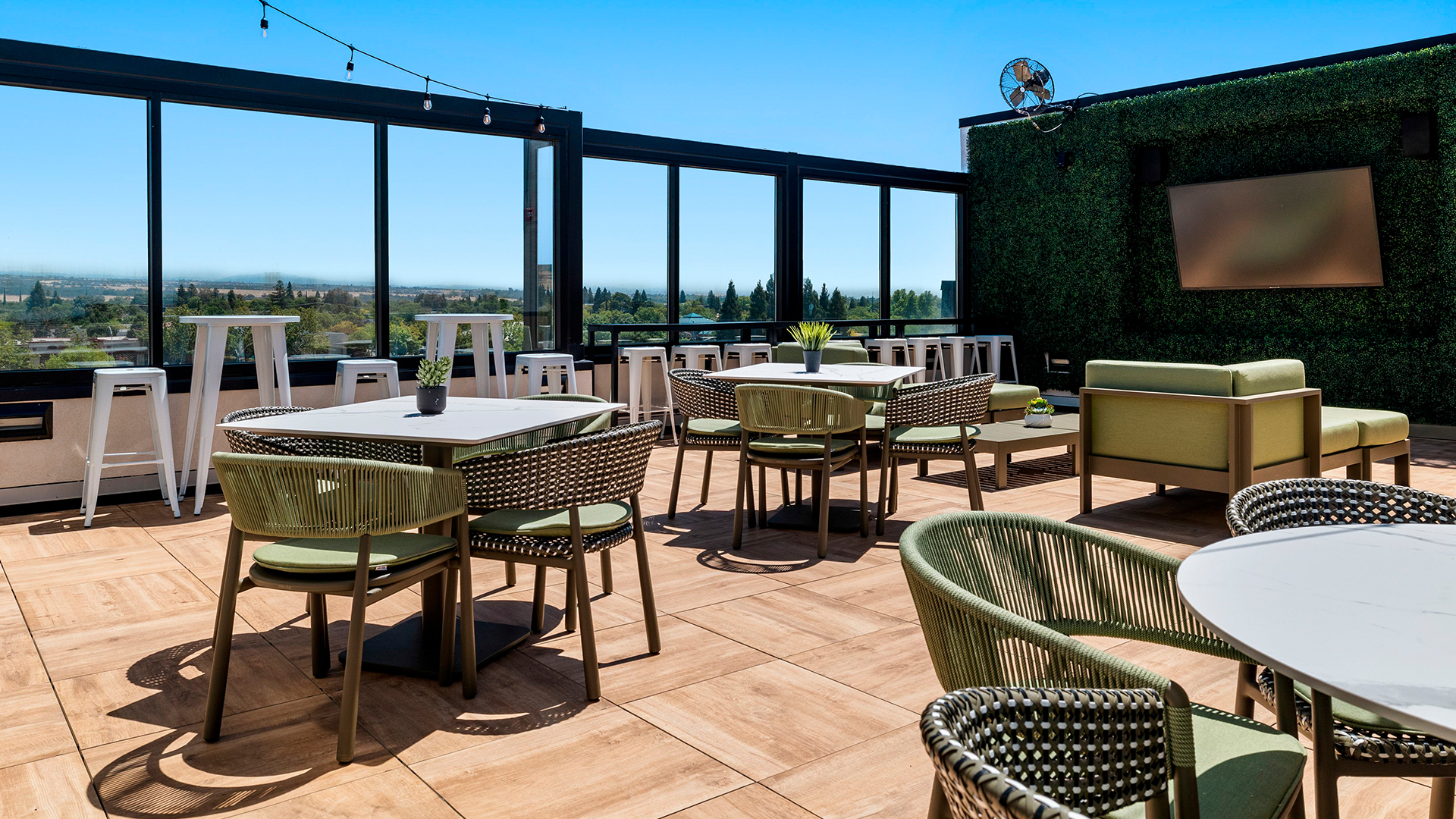 a patio with tables and chairs