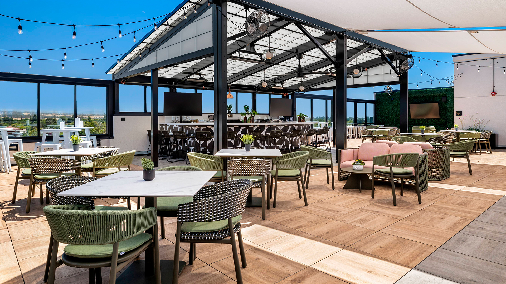 a patio with tables and chairs