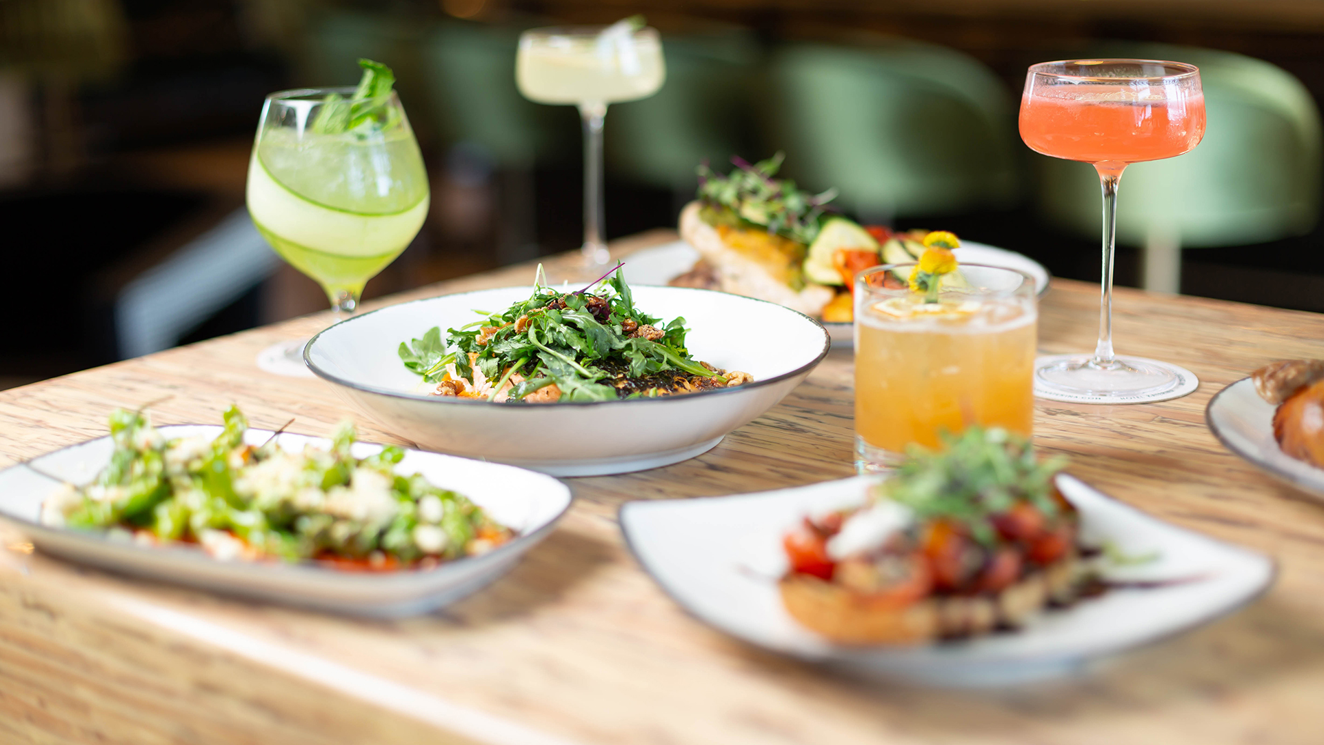a table with plates of food and drinks