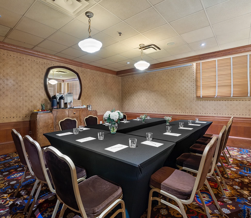 a room with a table and chairs