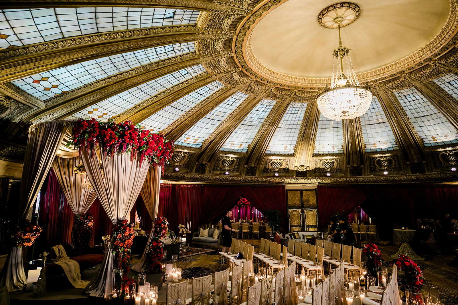 a room with a dome ceiling and chandelier