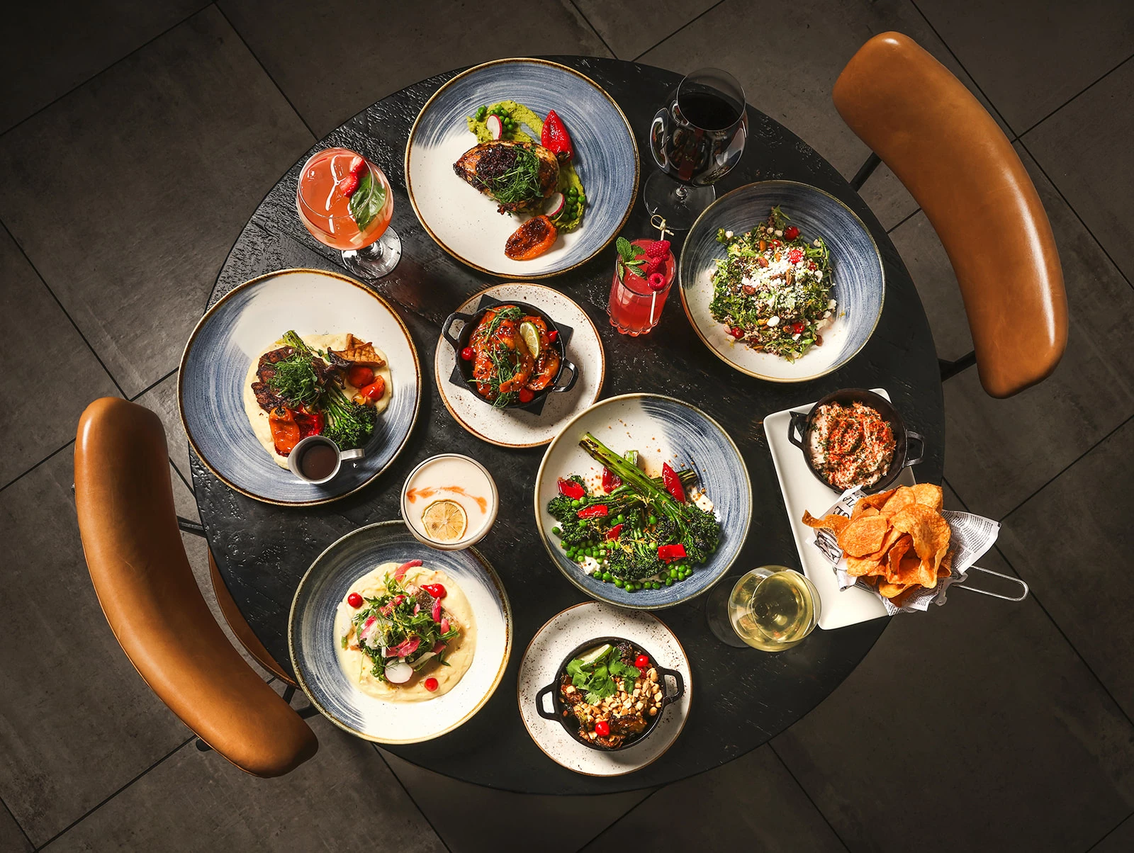 a table with plates of food and drinks