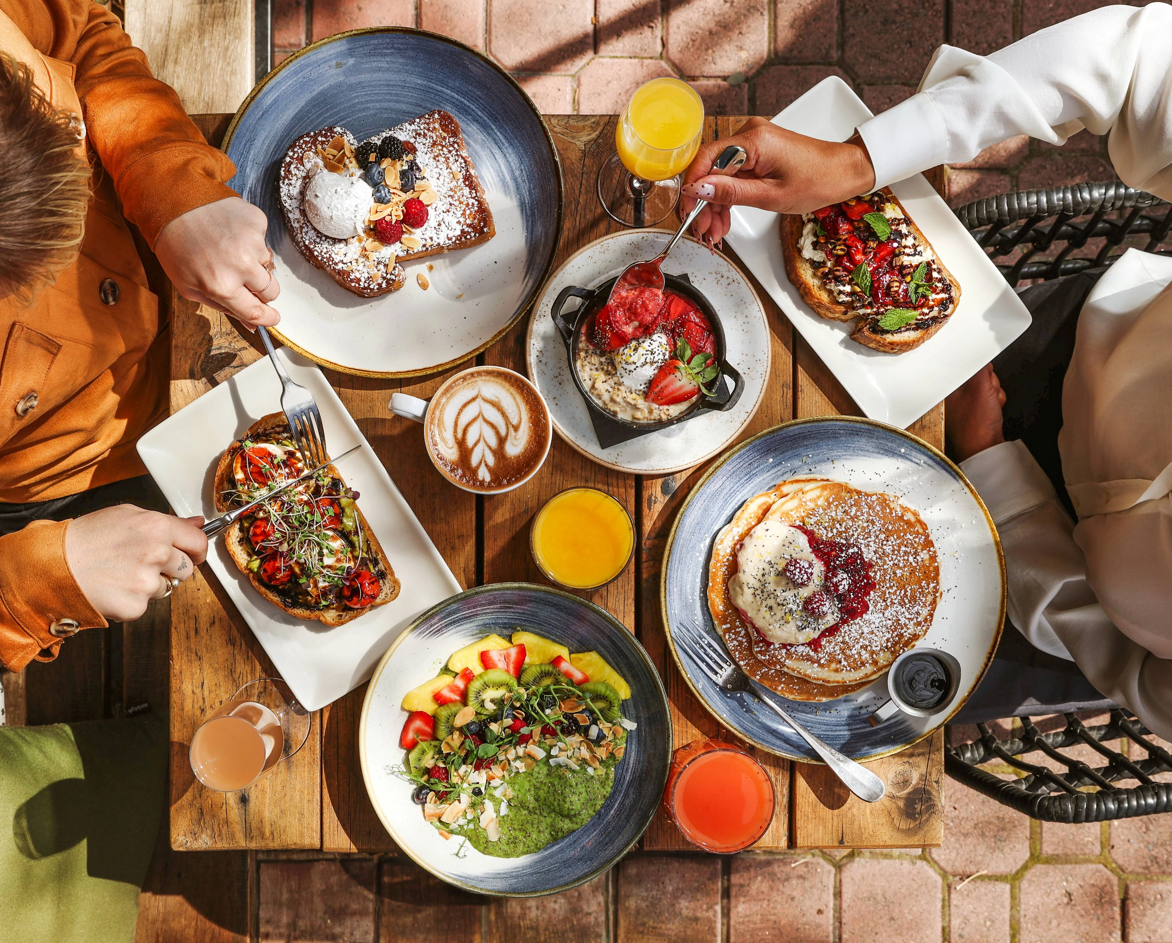a group of people eating food at a table