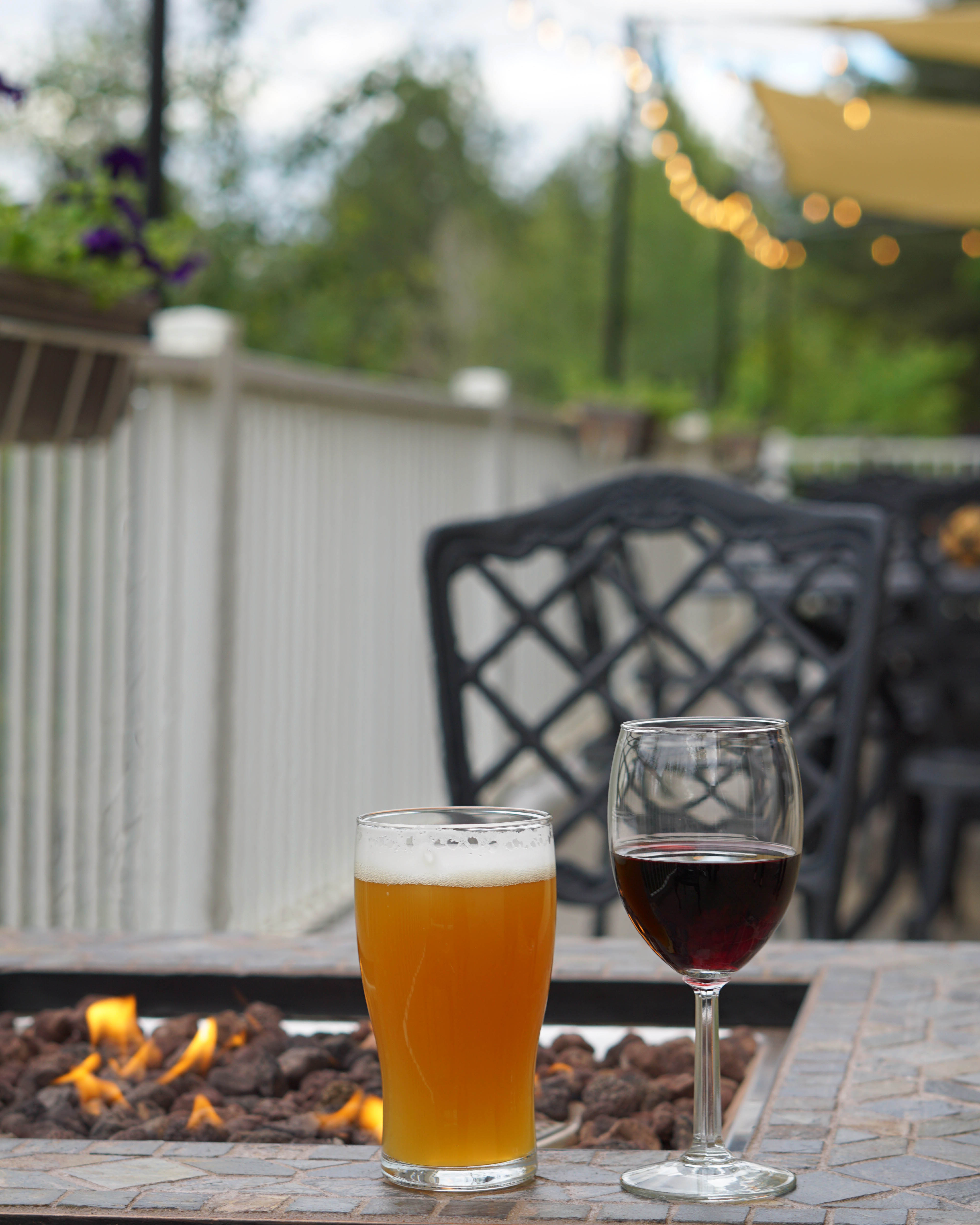 a glass of wine and a glass of beer on a table