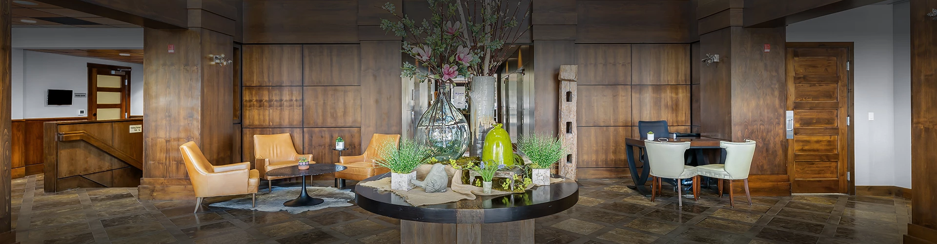 a table with vases of flowers and plants on it
