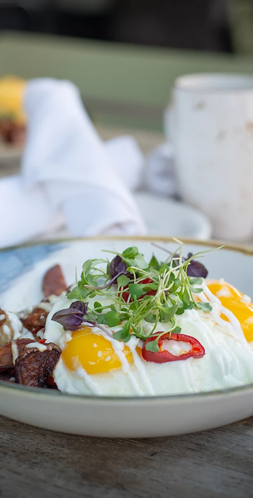 a plate of food with a fork and a napkin