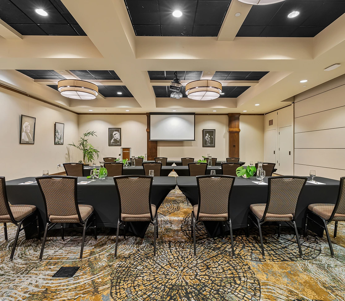 a room with a large table and chairs