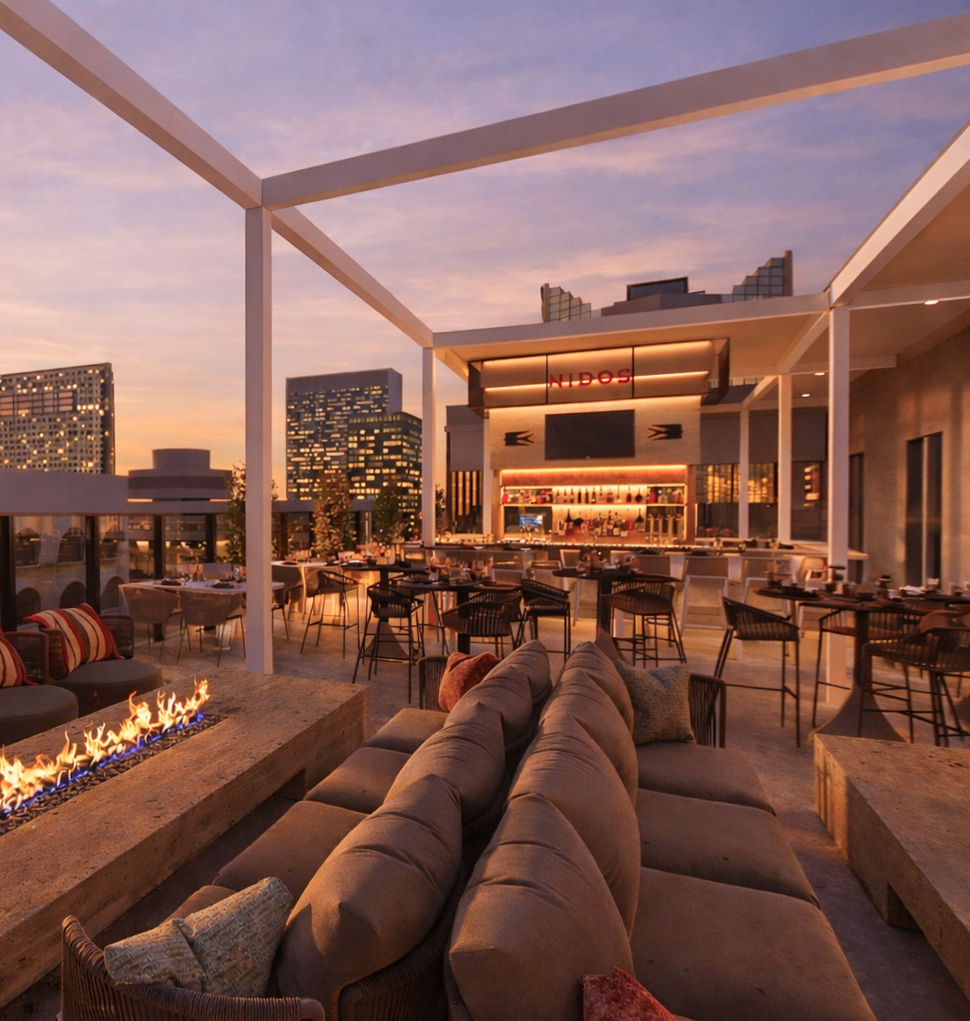 a patio with a fire pit and tables and chairs