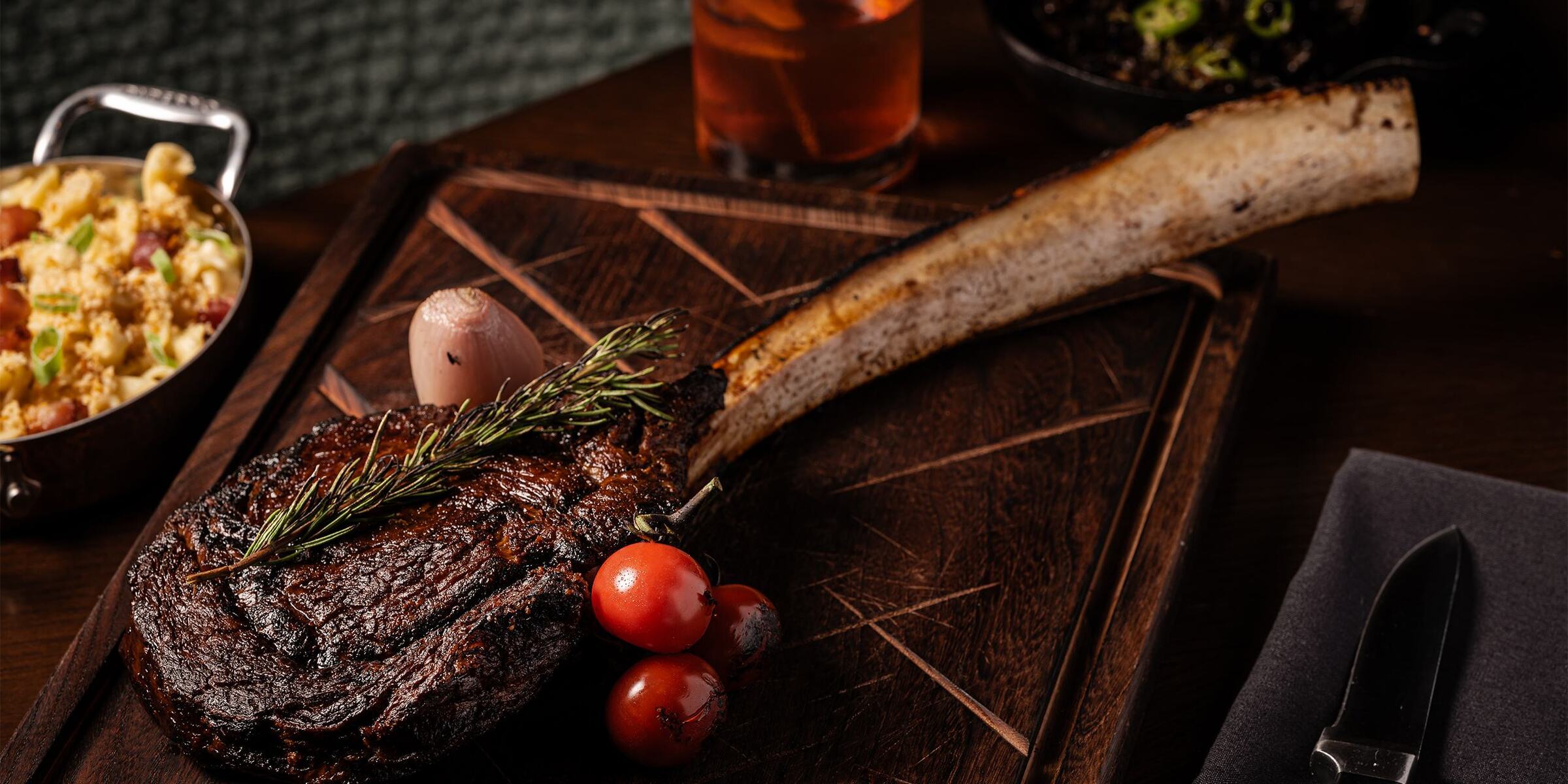 a piece of meat with vegetables on a wooden board