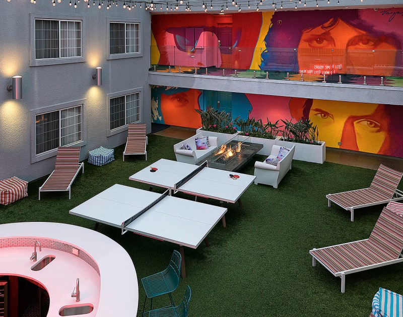 a patio with tables and chairs