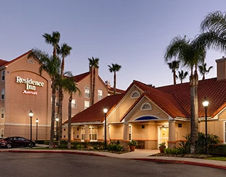 Exterior of the Residence Inn Hotel at sunset