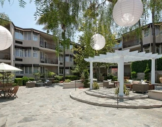 Hotel sitting area outside on a sunny day with