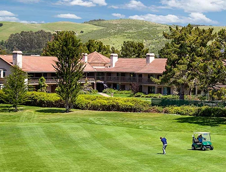 a man playing on a golf course