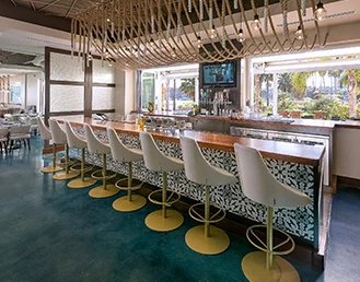 counter on a restaurant with white chairs