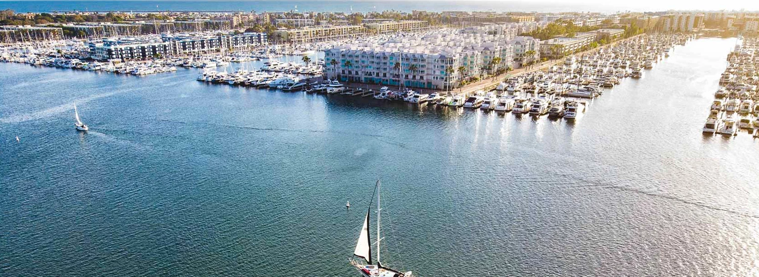 a body of water with boats and buildings along it
