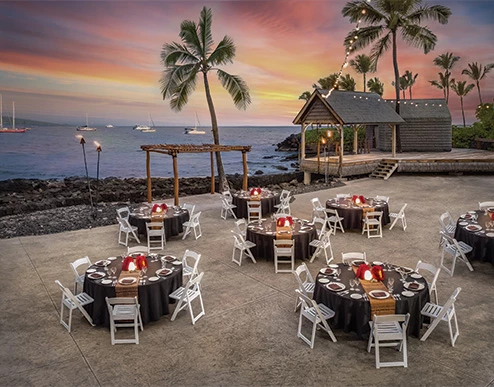 a beach with tables and chairs