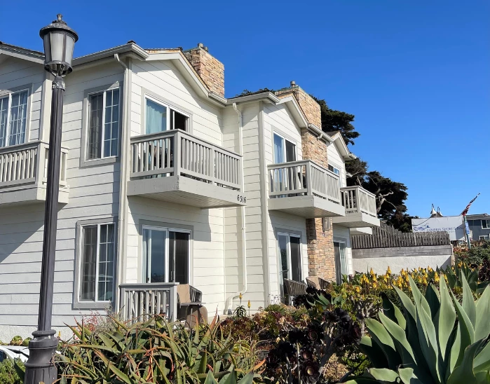 a white house with a balcony