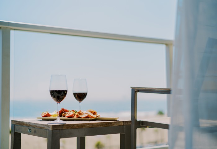 a table with wine glasses and food on it