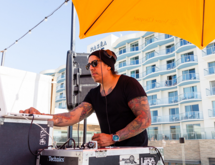 DJ playing outside at Pasea Hotel