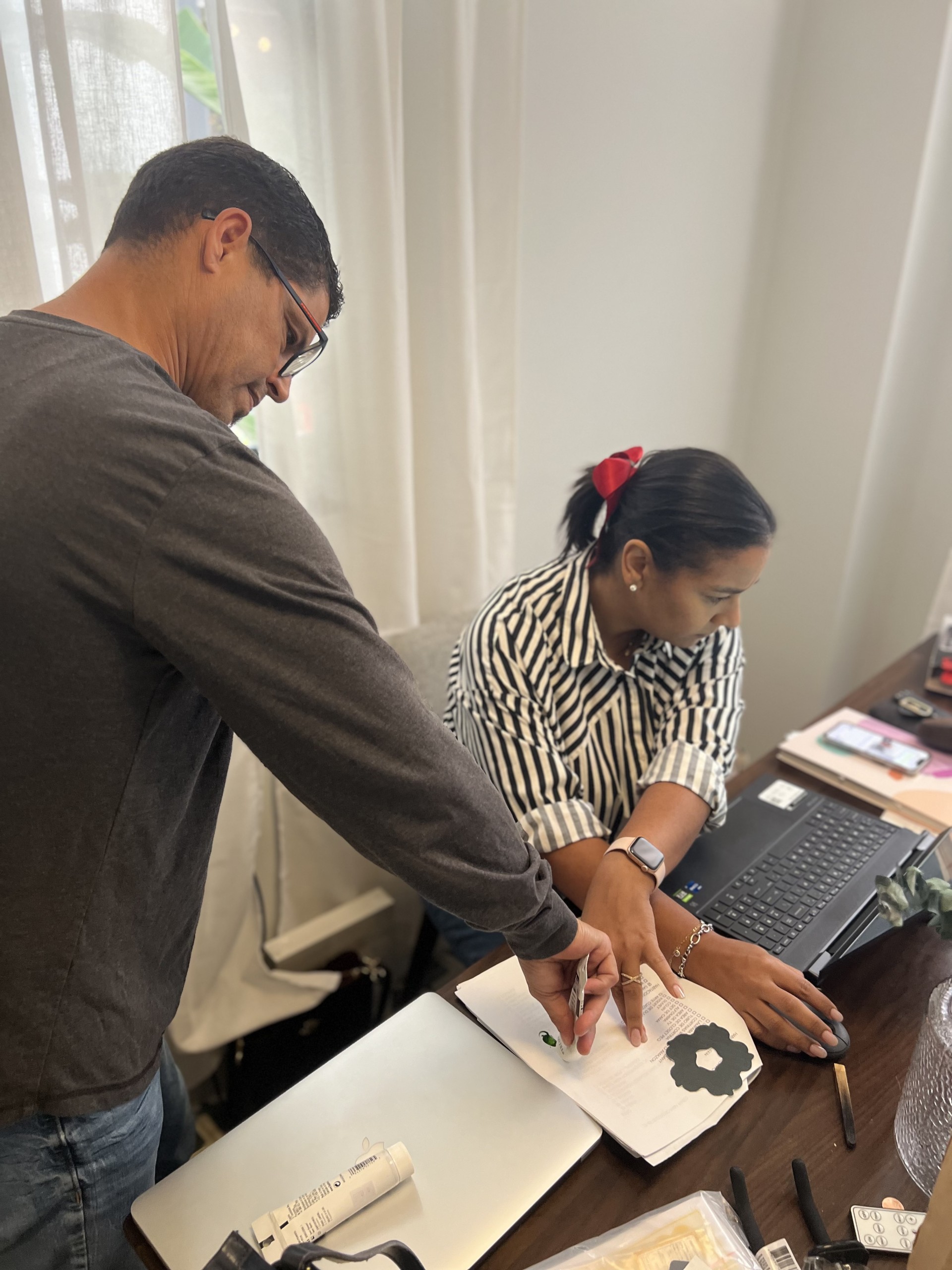 a man and woman sitting at a desk