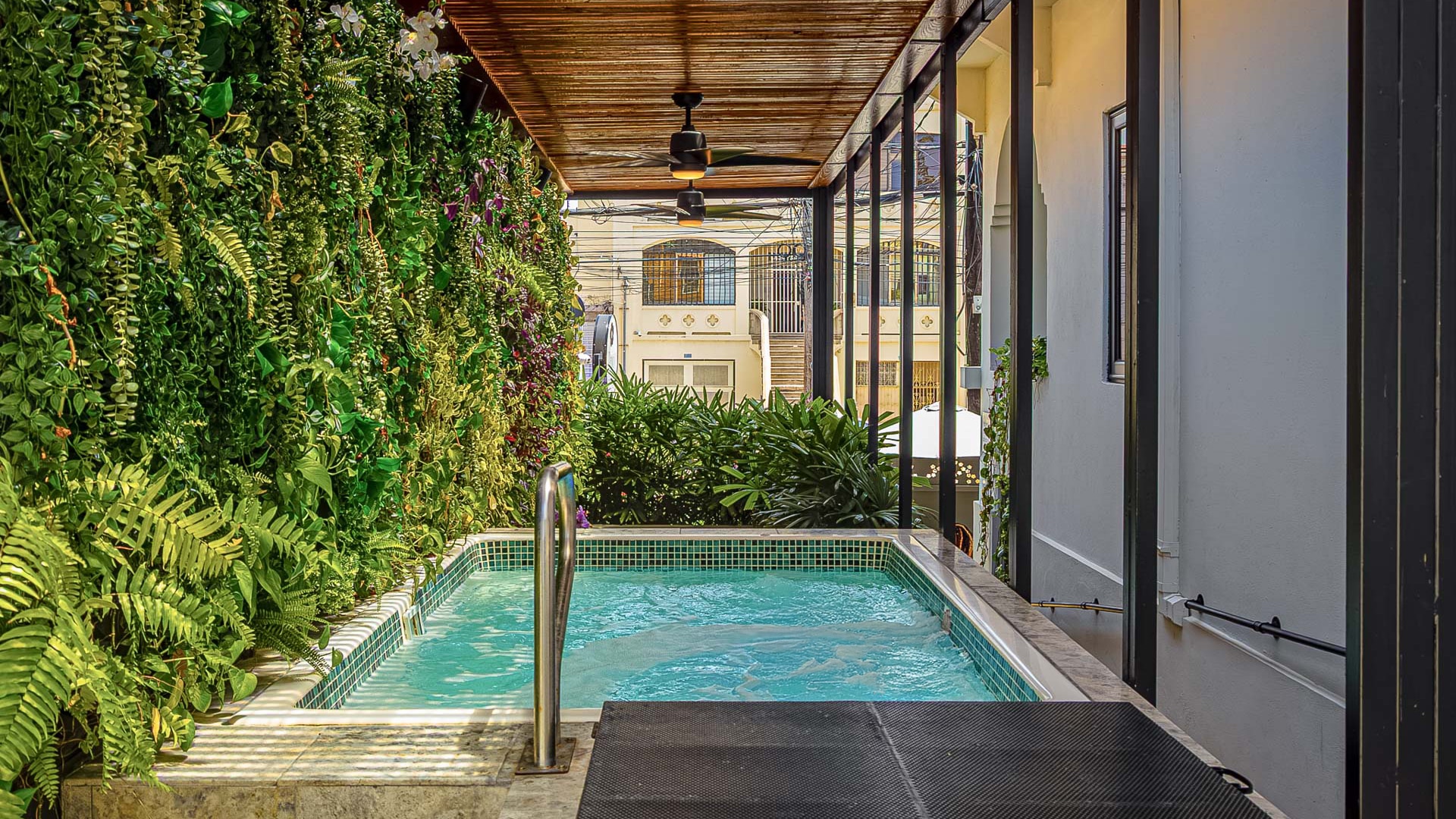 a swimming pool with a metal railing