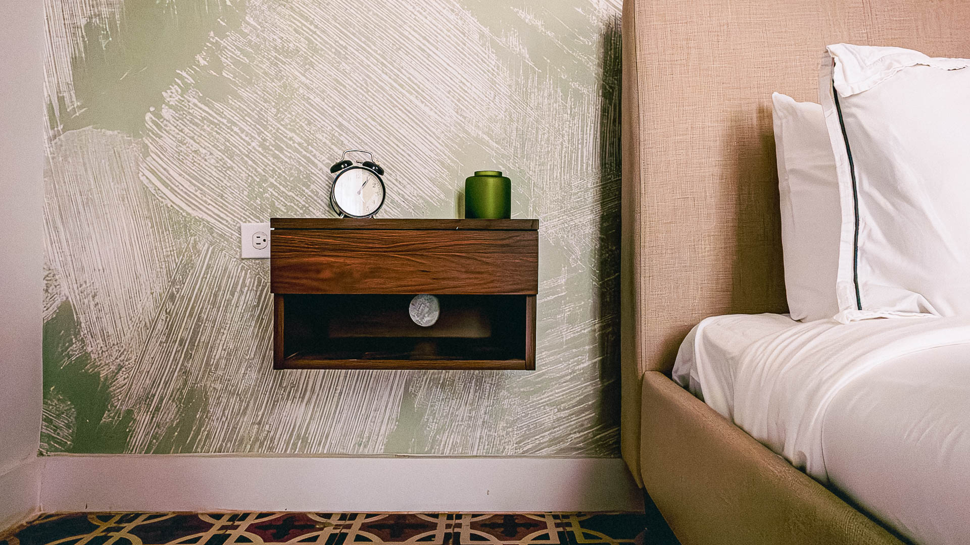 a clock on a nightstand