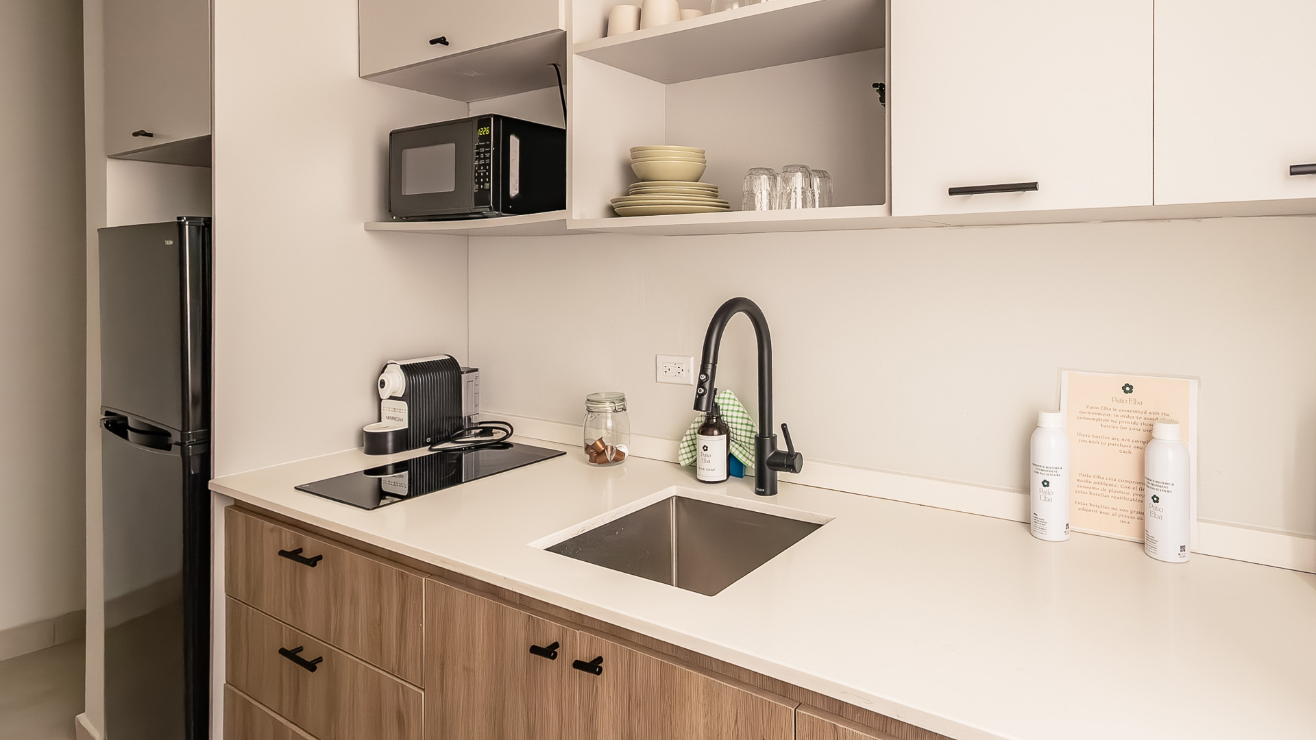 a kitchen with a sink and a microwave