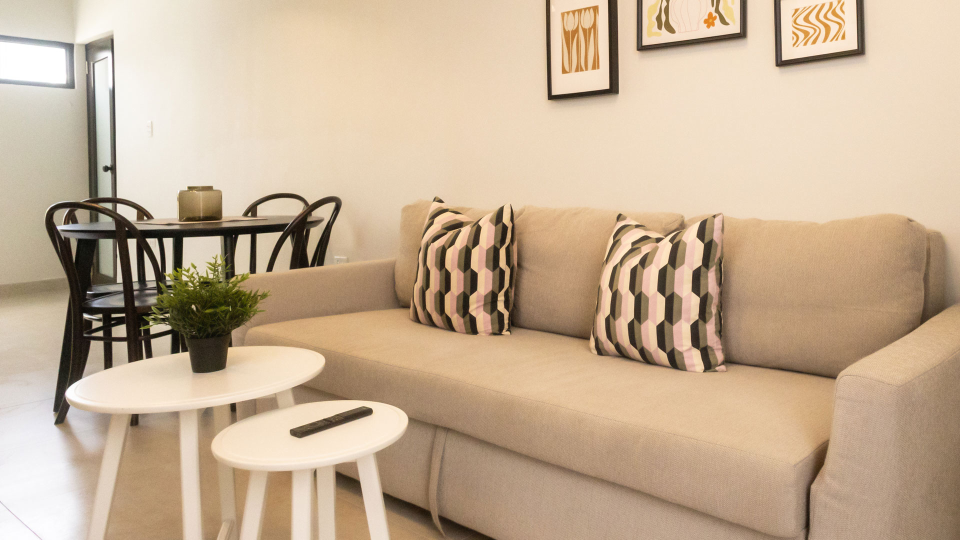 a couch with pillows and a table in front of it