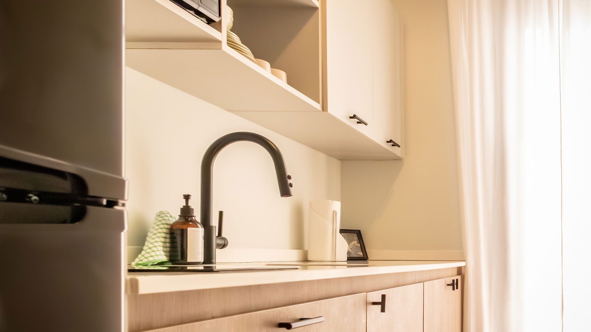 a sink with a faucet and a towel on the counter