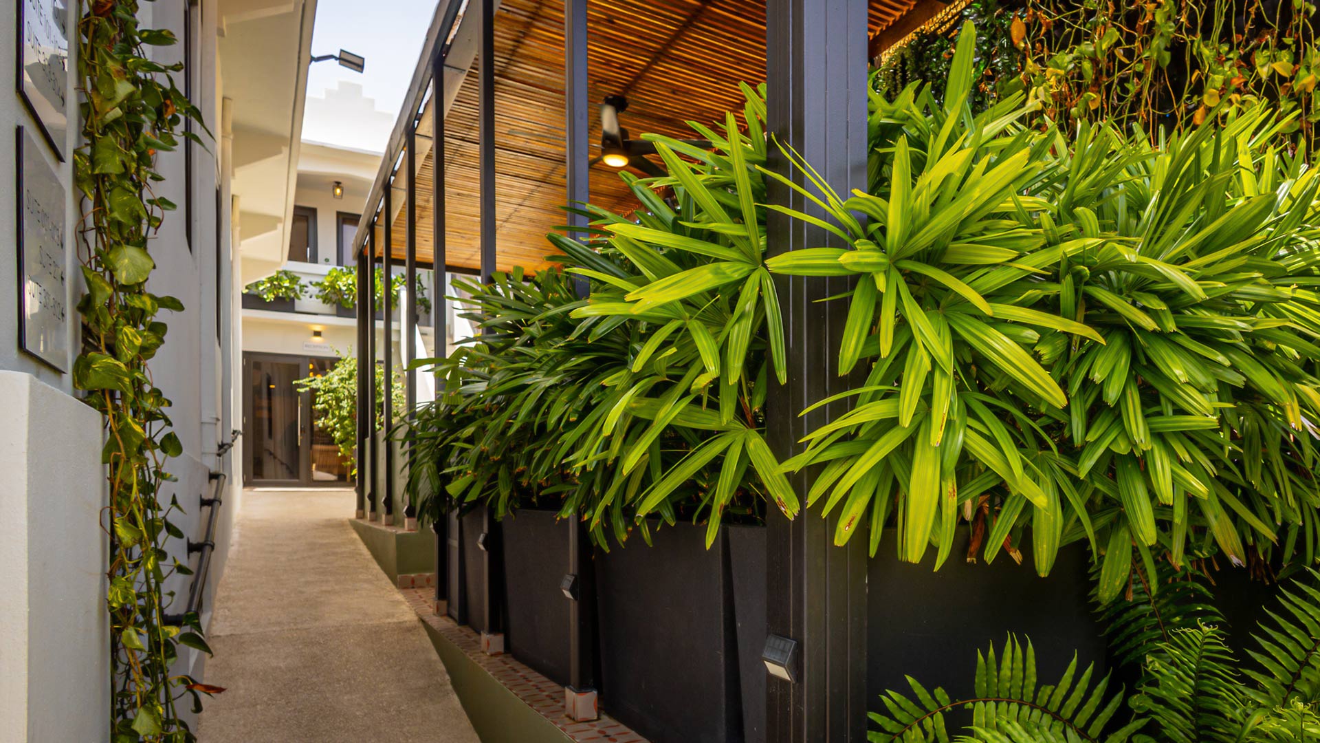 a green planter with a wooden roof