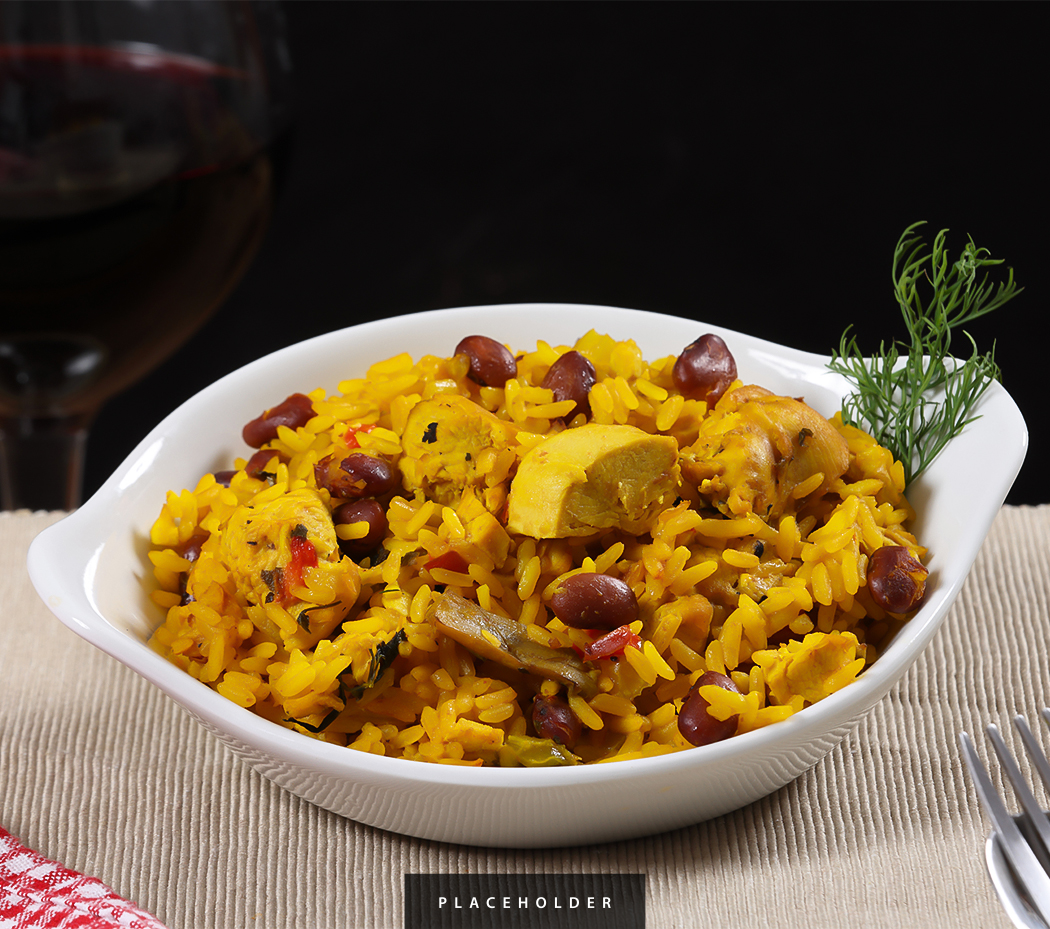 a bowl of rice with meat and beans