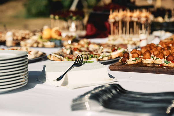 a table with plates of food and a fork