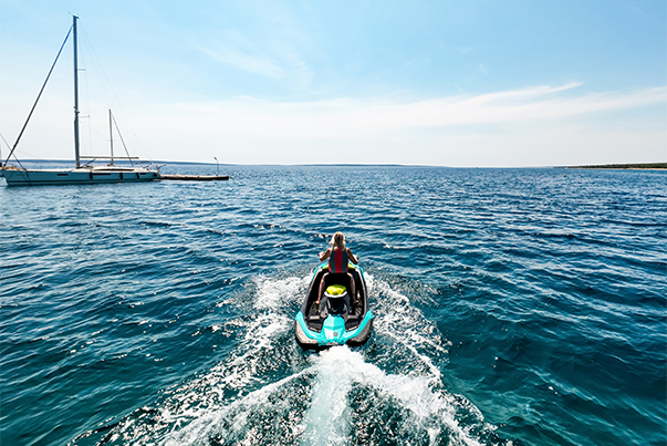 a person on a jet ski in the water