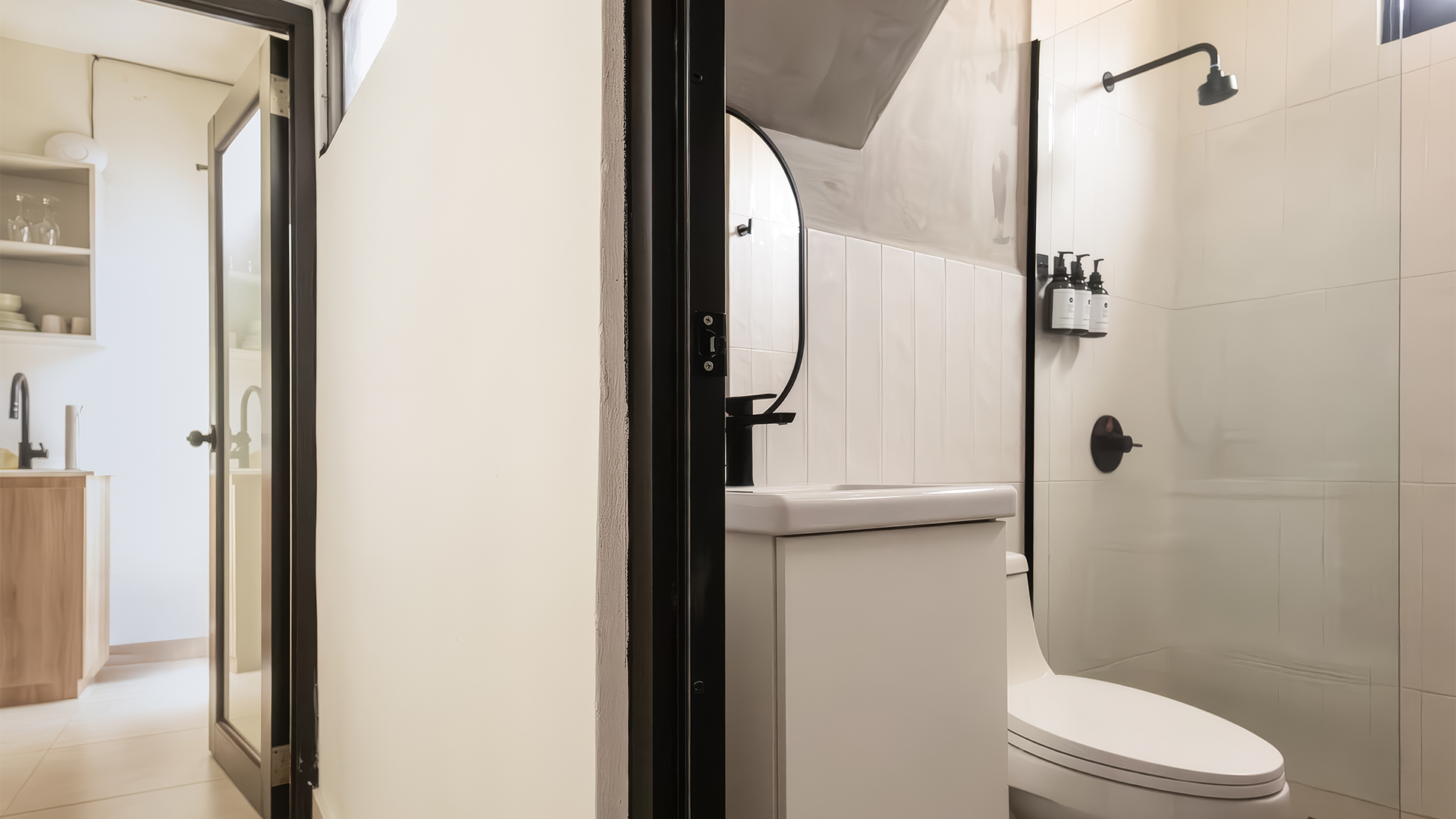 a bathroom with a mirror and toilet
