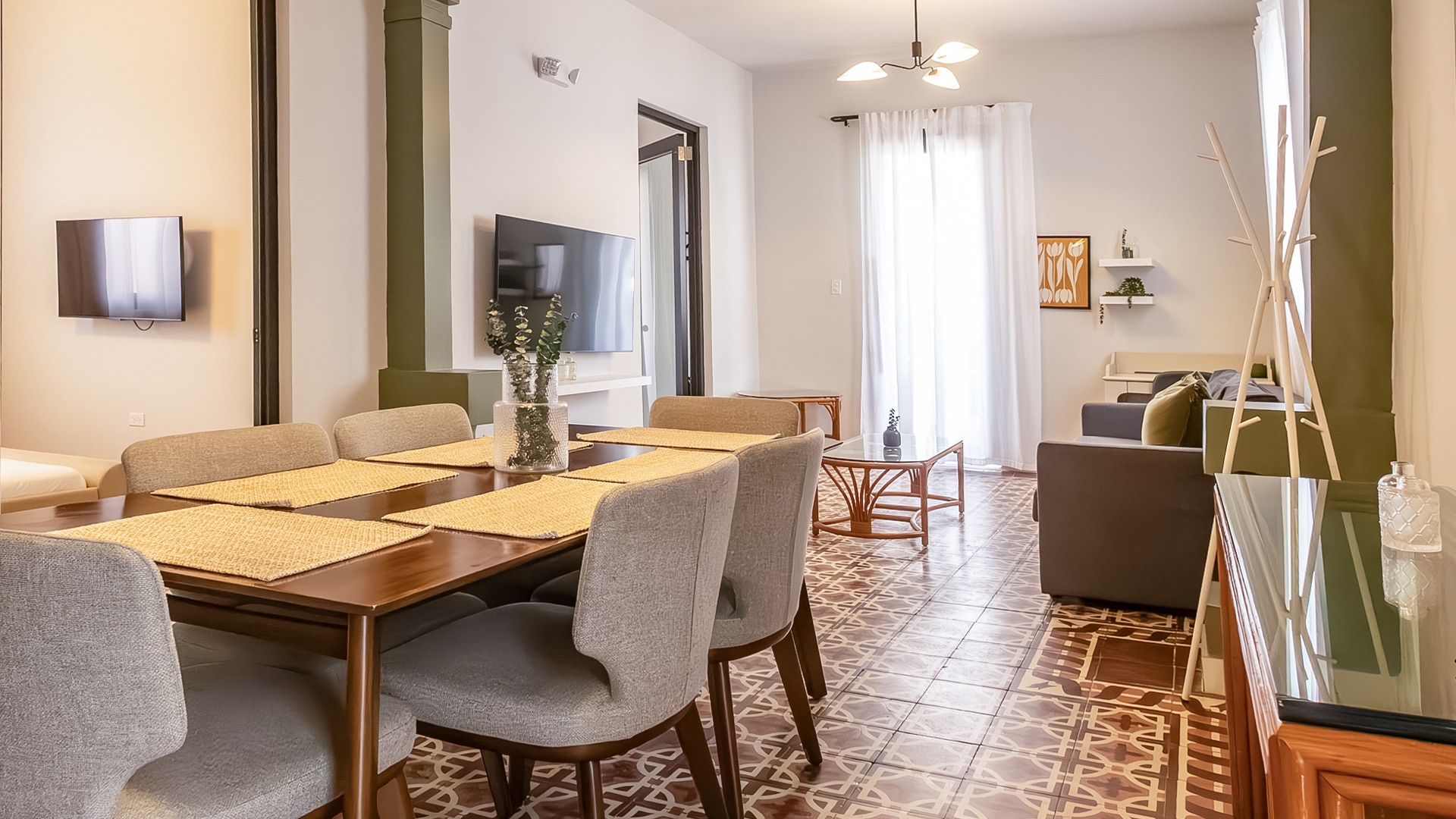 a living room with a table and chairs