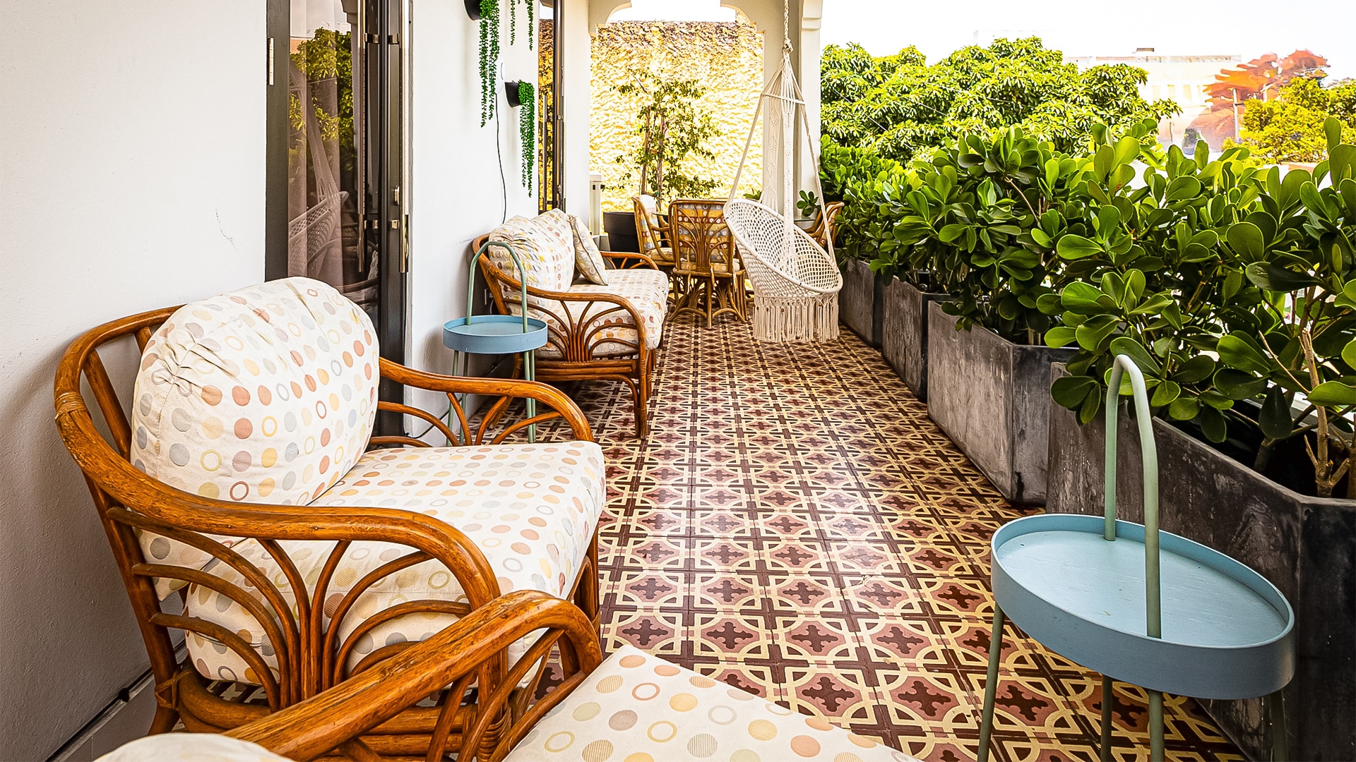 a patio with chairs and a table
