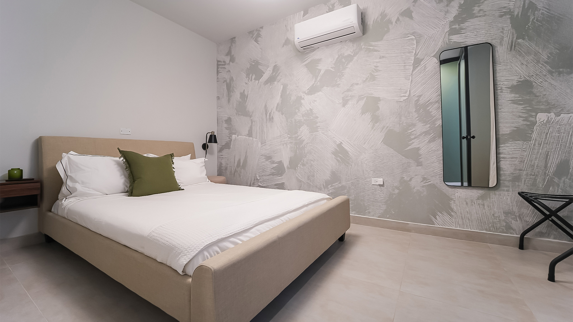 Cozy bedroom with wall mirror