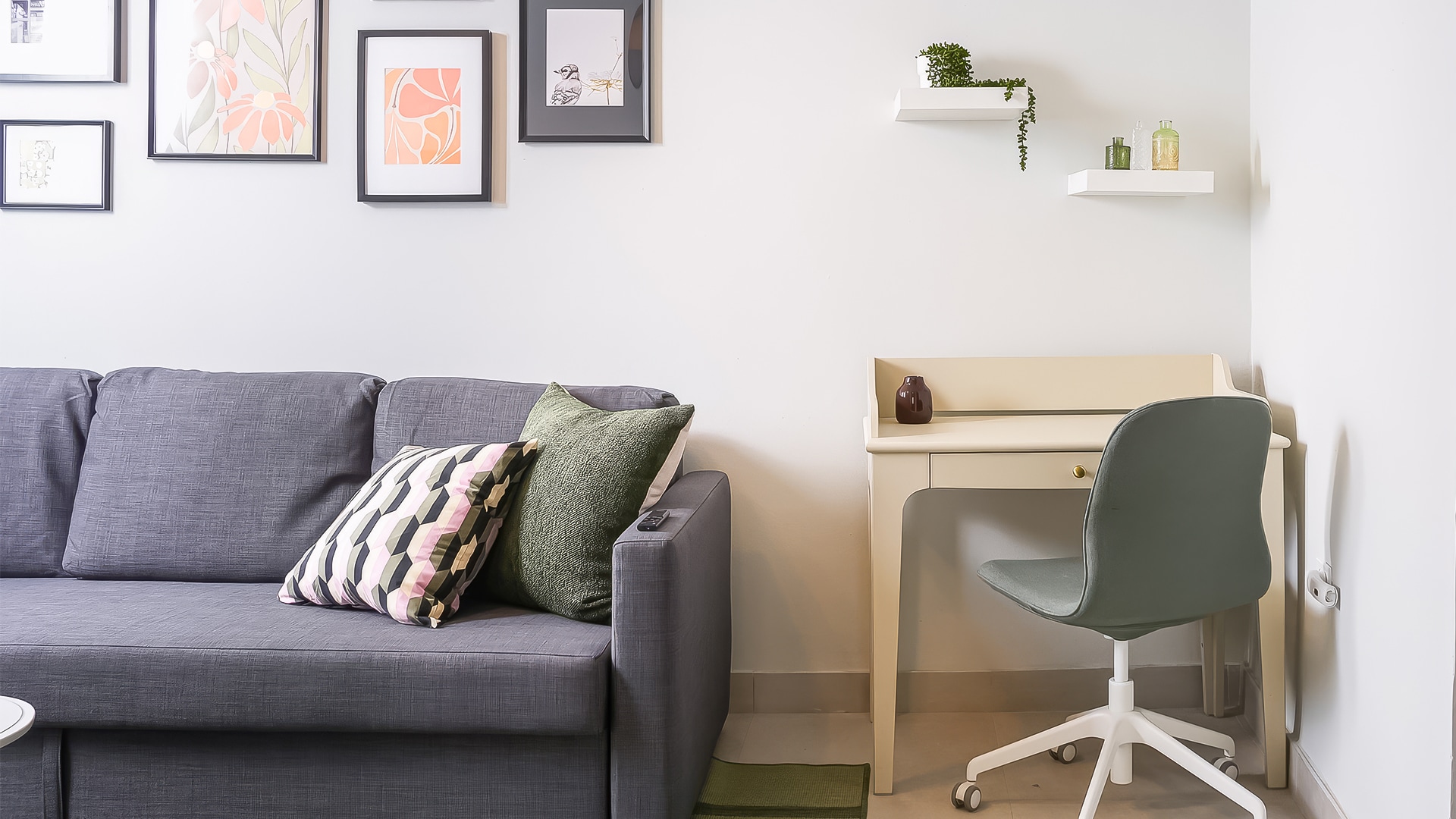 a couch and desk in a room