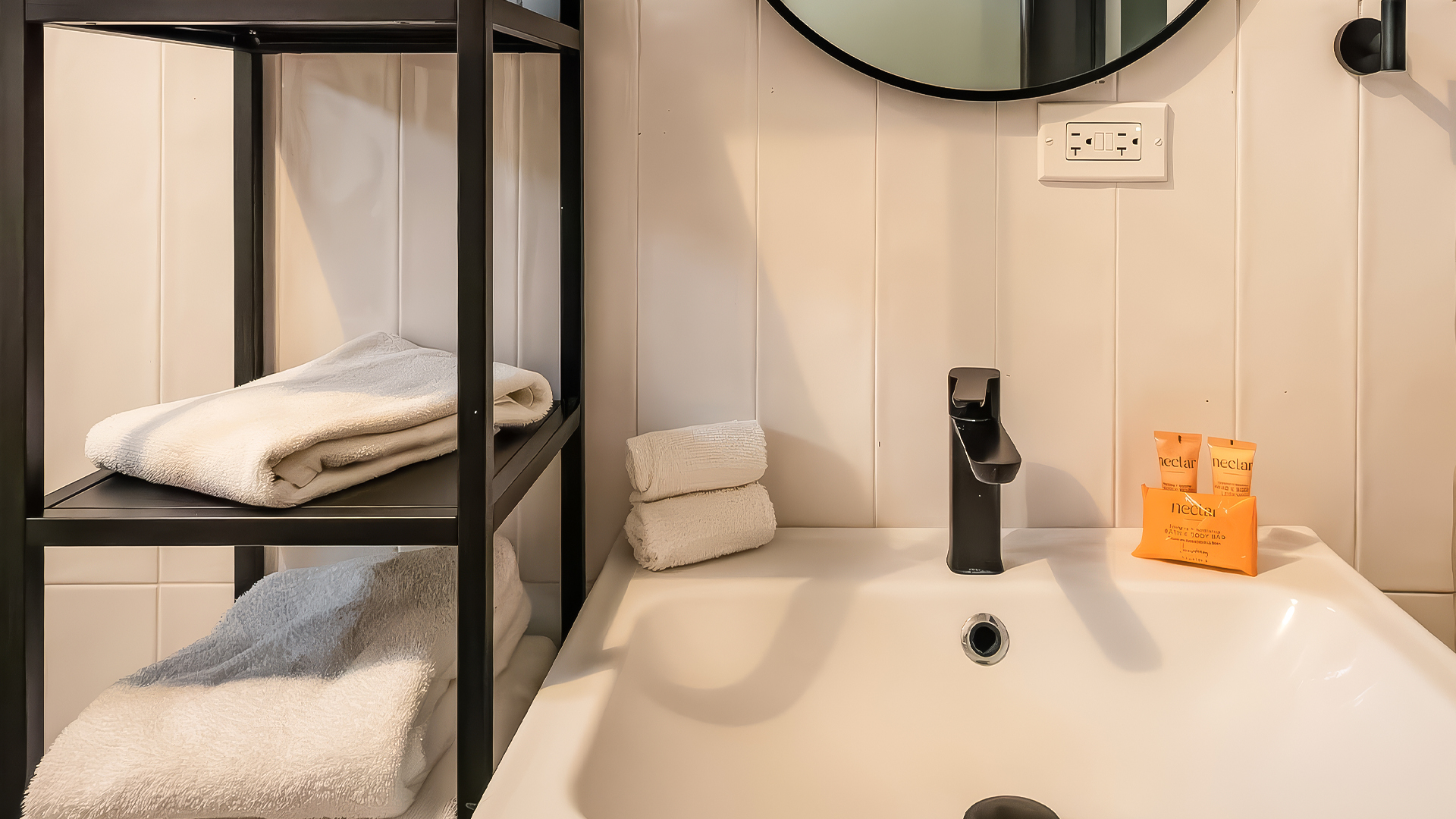 a bathroom with a sink and towels